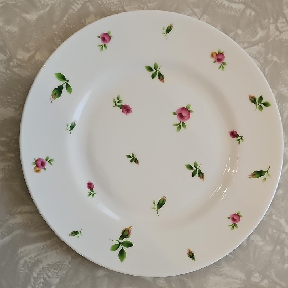 Royal Albert white Salad plate with pink rosebud and green leaf accents